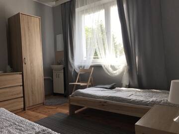 Фото номера Двухместный номер с 2 отдельными кроватями Комплексы для отдыха с коттеджами/бунгало Borowiak г. Szteklin 2